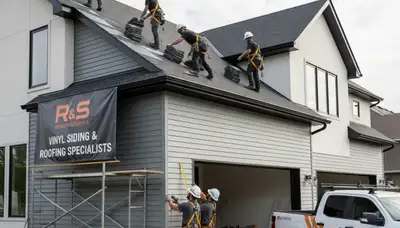 Professional roof installation crew working in Charlotte, NC by Next Level Exteriors